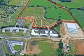 aerial view of land with a red line outlining the space for butterfield business park proposal