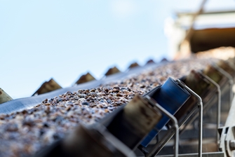 a view of gravel being carried on the mining conveyor belts