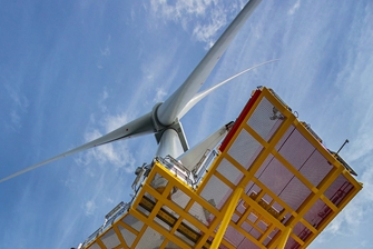 Shot looking upwards at wind turbine