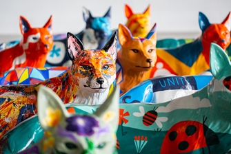 Photo of colorful painted foxes designed by local people